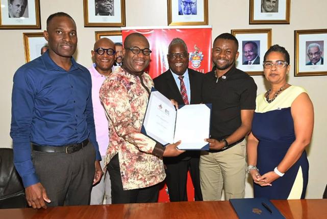 From left: Milton Dennis, estate manager, University of the West Indies (UWI), Mona Campus; Dr Ronald Robinson, consultant to the principal; Professor Densil A. Williams, pro vice‑chancellor and principal; Dr Peter Glegg, campus legal officer; Ockino Pet