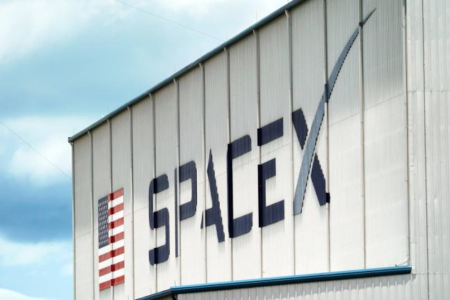AP
A SpaceX logo is displayed on a building, May 26, 2020, at the Kennedy Space Center in Cape Canaveral, Florida, USA.
