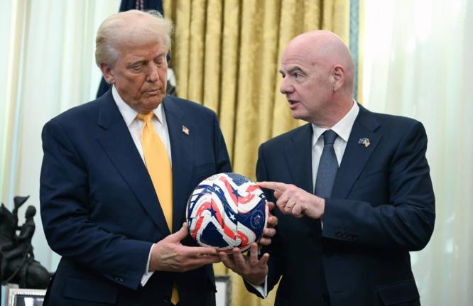  FIFA President Gianni Infantino, right, presents President Donald Trump with the new FIFA Club World Cup official ball in the Oval Office of the White House in Washington, March 7, 2025. (Jim Watson/Pool Photo via AP, file)