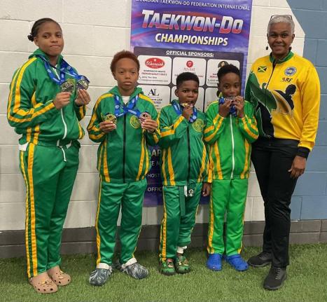 Jamaica’s juniors (from left) Abigail Dixon, Quinton Jackson, Romalachai Graham and Liam Laylor, show off their medals won at the 2026 North American and Caribbean International Taekwon-do Championship in Brampton, Canada. Master Joleen Masters (right) c