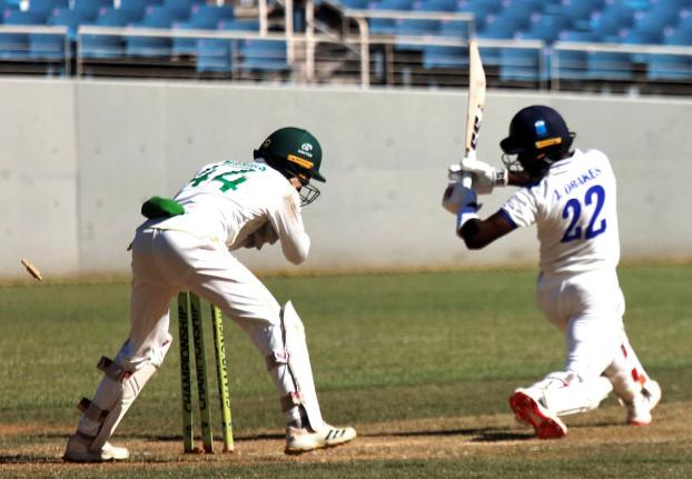 Barbados Pride’s Jonathan Drakes is stumped for 94 by wicketkeeper Romaine Morris of the Jamaica Scorpions on the opening day of their West Indies Championship match at Sabina Park yesterday.