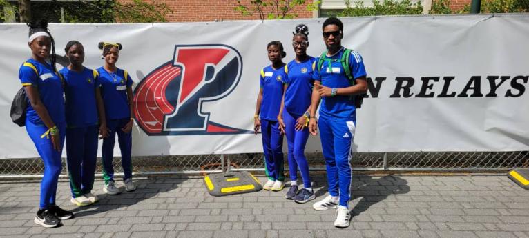 Meadowbrook coach Dino Rochester (right) and his quartet at the Penn Relays.