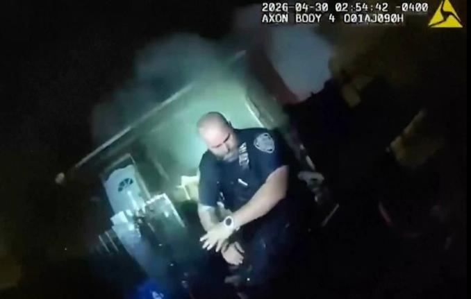 This image made from New York Police Department body camera video shows an officer after an explosion at a house while responding to a call of an armed man Thursday, April 30, 2026, in the Queens borough of New York. 