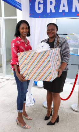Tamar Donaldson-Watson (left), senior teacher at the Jonathan Grant High School in St. Catherine accepts Caledonia Medical Laboratory (Biomedical’s) Impact Recognition presentation on behalf of the school’s Home Economics Department and teacher, Sanjae