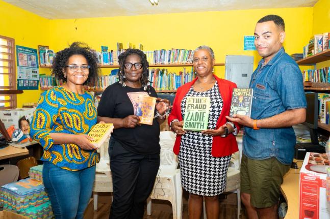 British actor, comedian, writer and musician Ben Bailey Smith (right) and his mother, Yvonne Bailey-Smith (second left) present a donation of books to Nichole Powell-Morgan, principal of St Mary’s Primary and Infant School, for use in the institution’s