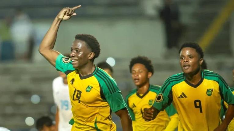 From left: Jamaica U20 players Brandon Bent (left) and Giovanni Taylor (right) celebrate the former’s last-minute goal during he Concacaf U20 Championship football game against Honduras on Sunday.