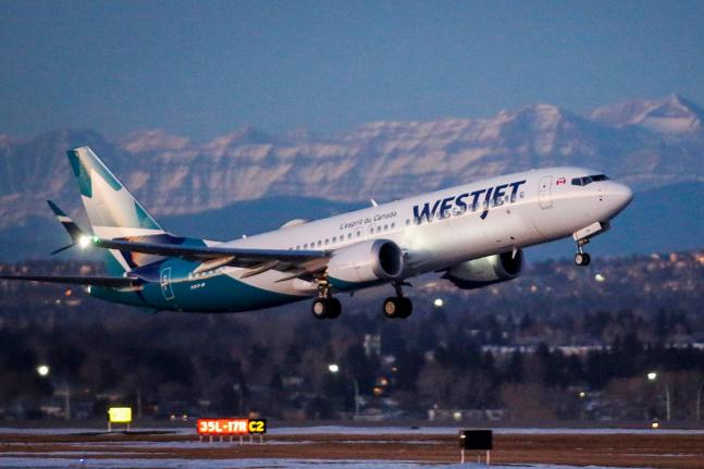 FILE - A westJet airplane takes off in Calgary, Alta., January 21, 202. (Jeff McIntosh/The Canadian Press via AP, File)