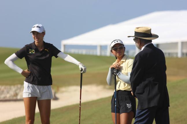 
Jamaica’s Mattea Issa looks a relaxed figure just before the opening tee-off at the CAC Games in Punta Cana, Dominican Republic. Looking on is Maria Lopez of Panama.