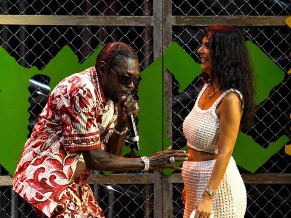 Vybz Kartel invited his fiancée Sidem Öztürk on stage to announce their pregnancy during his performance at the Reggae Land 2026 music festival in the United Kingdom on Sunday.