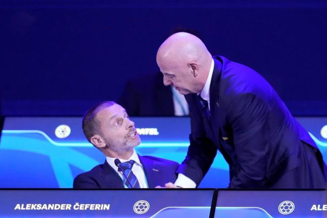 FIFA President Gianni Infantino (right) talks to UEFA President Aleksander Ceferin during the FIFA 75th Congress at the Conmebol Convention Center in Luque, Paraguay, Thursday, May 15, 2025. 