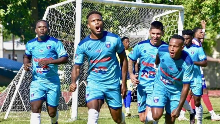 Salcedo players celebrate a goal.