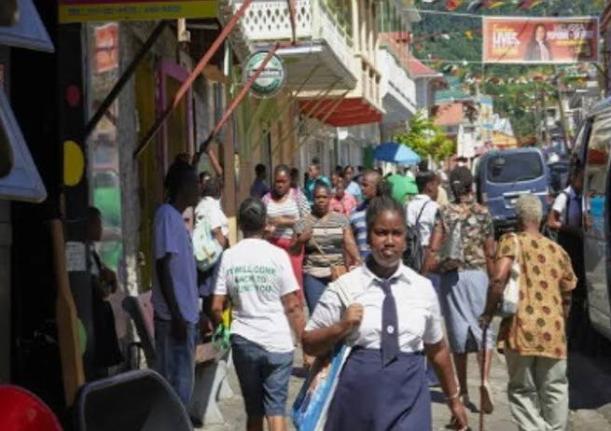 People walking along a street in Dominica.