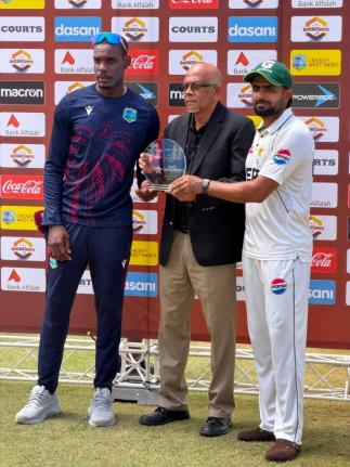 Players of the Series Justin Greaves (left) and Babar Azam (right) accept their award from CWI vice-president Azim Bassarath.  