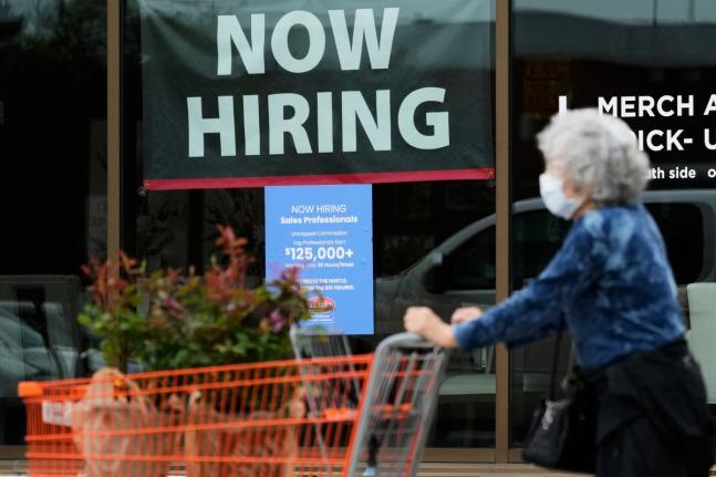 AP 
Hiring sign for sales professionals is displayed at a store, in Vernon Hills, Ill., Wednesday, April 15, 2026. 