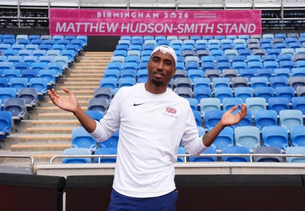 Britain’s Matthew Hudson-Smith poses in front of a stand named after him, during a training session ahead of the start of the European Athletics Championships, in Birmingham, England, yesterday.