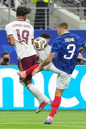 France’s Lucas Digne (right) fouls Spain’s Lamine Yamal in the penalty box for a Spain penalty kick during a World Cup semi-final match in Arlington, Texas, near Dallas, on Tuesday, July 14.