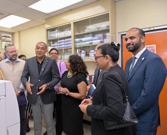 Minister of Health and Wellness Dr Christopher Tufton (second left), emphasises the benefits of the antimicrobial resistance (AMR) regional reference referral laboratory of the Caribbean Public Health Agency (CARPHA) at the recent official opening of the f