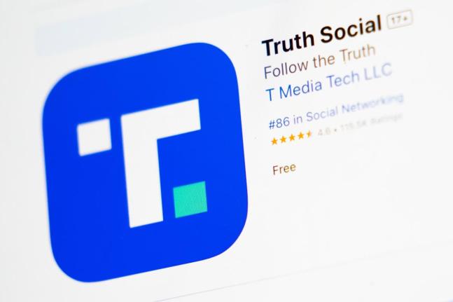The download screen for the Truth Social app is displayed on a laptop in March 2024 in New York.  