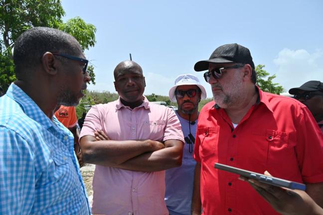 From left: Garth Wilkinson, councillor for Falmouth Division; Lothan Cousins, opposition spokesperson on land; Isat Buchanan, opposition spokesperson on youth and human rights; and Mark Golding, opposition leader, in conversation during a tour of Cooper’