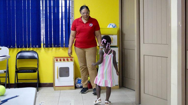 A practitioner observes a child during an Ages and Stages Questionnaire-Jamaica (ASQ-J) screening session at the Caenwood Resource Centre in St Andrew. 