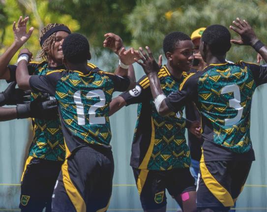 Jamaica Under-14 players celebrate scoring against Aruba during their Caribbean Football Union (CFU) Challenger Series in the Dominican Republic yesterday. 
