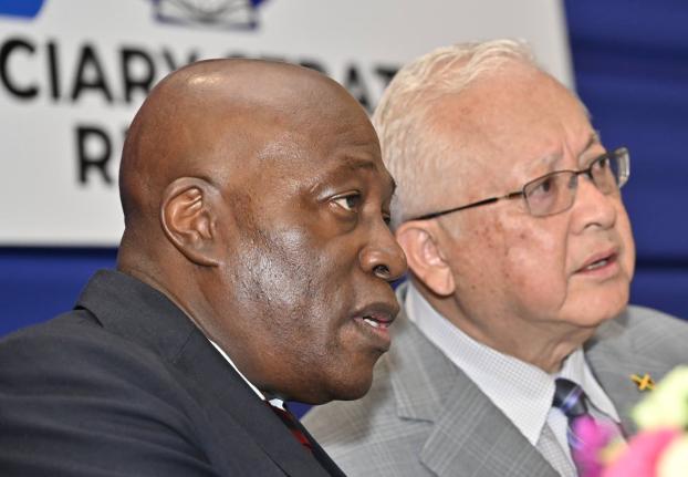 Delroy Chuck (right), minister of justice and constitutional affairs, chats with Justice Bryan Sykes, chief justice of Jamaica, during the Judiciary’s Strategic Management Retreat at the AC Hotel in Kingston on Monday.