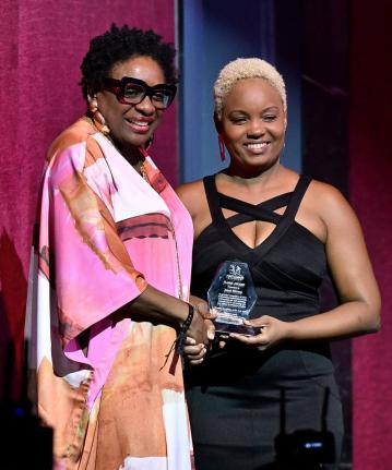 Journalist Janet Silvera receives the inaugural First Dance Studios FLAME Award from founder and artistic director Jody-Marie Smith during the National Dance Theatre Company’s 64th Season of Dance finale in Montego Bay on Sunday.