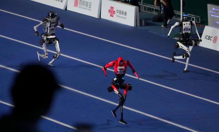 AP 
Robots compete in the 100-metre race during the opening ceremony of the World Humanoid Robot Games in Beijing, yesterday.