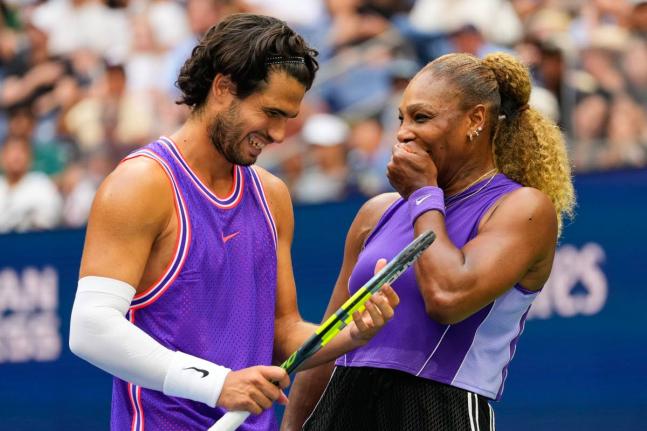 Carlos Alcaraz, of Spain (left) and Serena Williams, of the United States, talk on the court during a mixed doubles match at the US Open tennis championships, yesterday, in New York. 