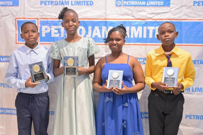 Recipients of the Petrojam 2026 Primary Exit Profile (PEP) Scholarship (from left) Kenzo Riley and Denesha Watson of Greenwich Primary School and Joe-Lee Gordon and Neymar Price of St Andrew Primary School display their awards during the 20th anniversary P
