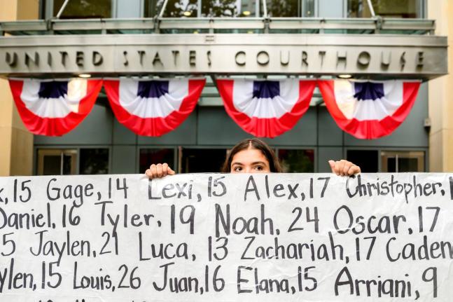 Olivia Konar holds a banner with names of young people who advocates say died as a result of social media outside the Ronald V. Dellums Federal Building and US Courthouse on Tuesday, August 18, in Oakland, California. Her sister Coco Konar died in 2022 whe
