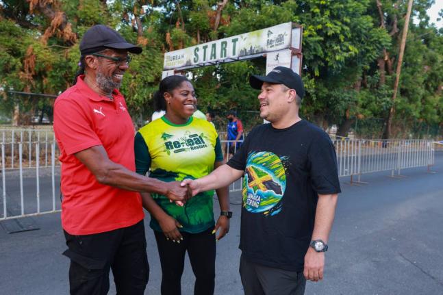 Alfred Francis (left), Race Director at Running Events Jamaica, shares a moment with  Matthew Samuda (right), Minister of Water, Environment and Climate Change, and Francine Black Richards, Senior Director, Corporate Communications and Marketing at the For