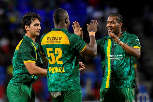 Jamaica Kingsmen players (from left) Hunain Shah, skipper Rovman Powell and Keemo Paul celebrate the fall of a wicket during the Caribbean Premier League T20 cricket match against St. Kitts and Nevis Patriots at Warner Park, St. Kitts on Thursday, August 2