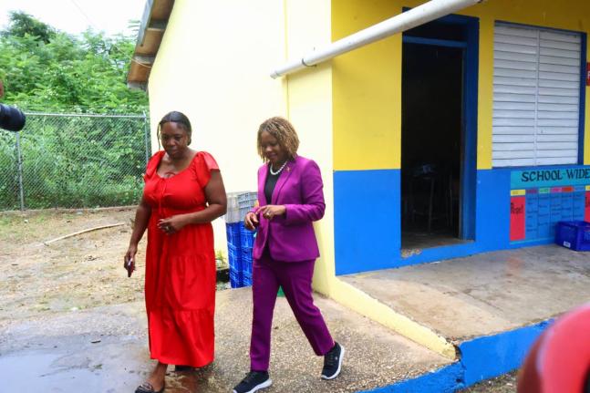 Minister of Education, Skills, Youth and Information, Senator Dr Dana Morris Dixon (right), tours the Ferris Primary School in Westmoreland with the principal of the institution, Tracie Campbell, on Wednesday, September 2.