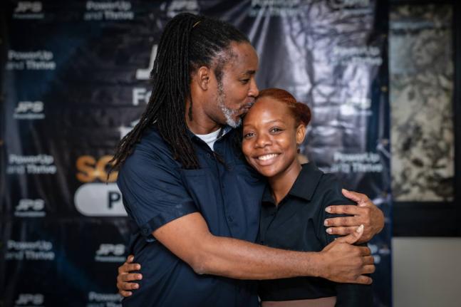 All set to start her first year at the University of Technology, Chritine-Ameila Seville receives a kiss from her proud father, Christopher Seville, a teacher’s aide at the Jamaica Association for the Deaf. The younger Seville was a recipient of the JPS