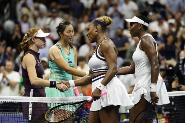 
Venus (right) and Serena Williams (centre), of the United States, congratulate Maya Joint (left) of Australia, and Hao-Ching Chan, of Taiwan, after their women’s doubles match at the US Open tennis championships on Friday.