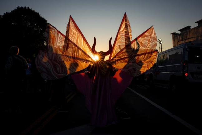 People participate in J'Ouvert festivities ahead of the West Indian American Day Parade at sunrise on Labor Day in the Crown Heights and Flatbush neighborhoods of Brooklyn, New York, on Monday. - AP Photo