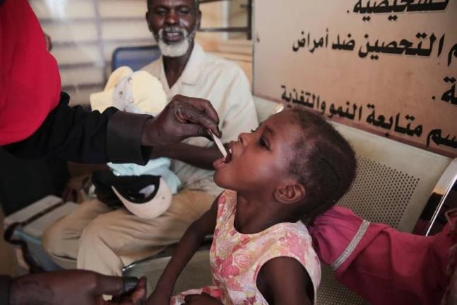 A Sudanese girl receives an oral cholera vaccine during a vaccination campaign conducted by health ministry workers in Khartoum, Sudan, on August 13, 2025. 