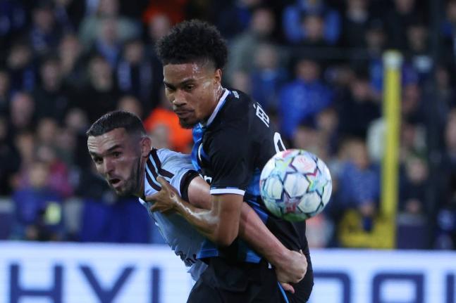 Aston Villa’s John McGinn (left) battles for the ball with Brugge’s Felix Lemarechal during the Champions League opening phase football match in Bruges, Belgium, yesterday.