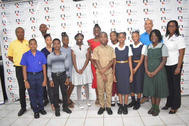 WINDALCO representatives (from left) – Community Relations Administrator Winston Watson; Employee and Community Relations Manager Lanceroy Morris; Port Manager Art Banton, and Snr Information & Public Affairs Officer Monique Grange, with PEP scholarship 