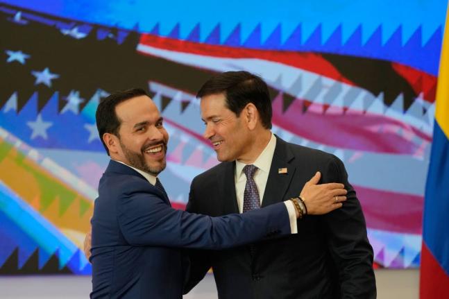 Colombian President Abelardo De La Espriella (left) and US Secretary of State Marco Rubio embrace during a bilateral agreement signing ceremony in Barranquilla, Colombia, Tuesday.
