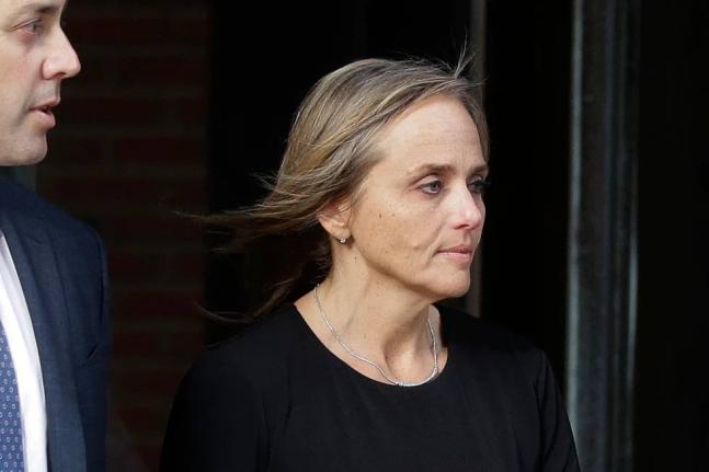 District Court Judge Shelley Joseph departs federal court, April 25, 2019, in Boston. 
