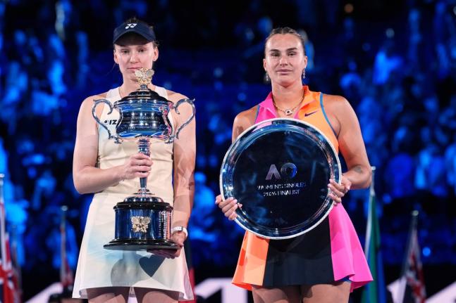  Elena Rybakina (left) of Kazakhstan, holds the Daphne Akhurst Memorial Cup after defeating Aryna Sabalenka (right) of Belarus, in the women’s singles final at the Australian Open tennis championship in Melbourne, Australia, January 31, 2026. 