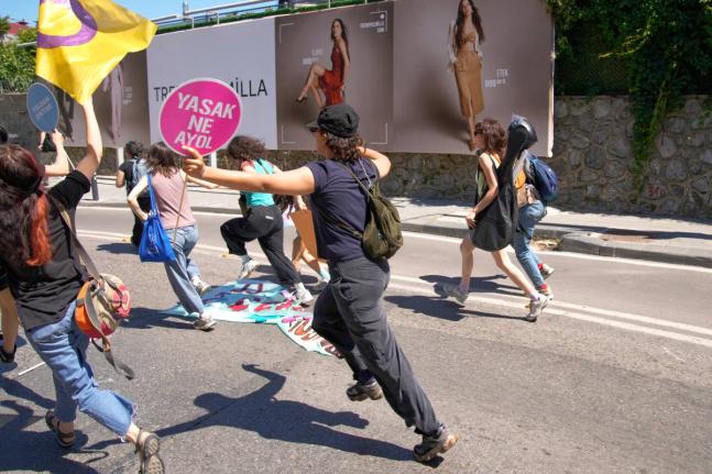 People run from the police during a march in support of transgender people and their rights during the LGBTQ Pride week, in Istanbul, Turkey, on June 21.