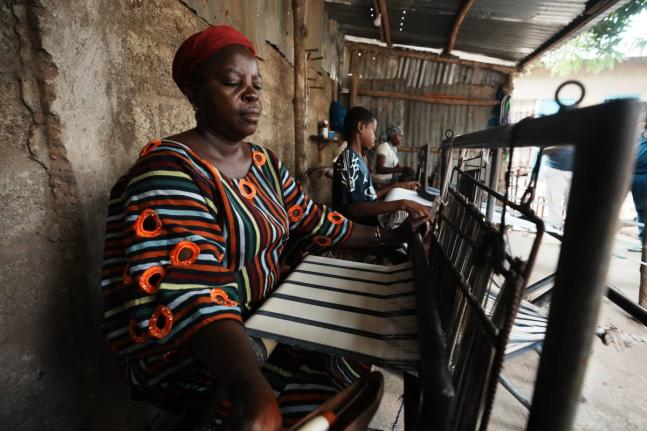 Chabi Baké, a mother of five, weaves in Parakou, northern Benin, Saturday, May 16, 2026. 
