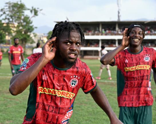 Montego Bay United’s Dwight Merrick (left) and teammate Deonjay Brown  celebrate a goal during their Jamaica Premier League match against Chapelton Maroons at Jarrett Park yesterday. 