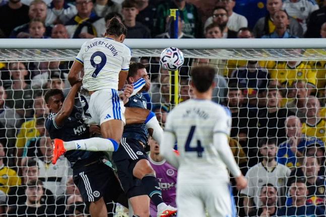 Leeds United’s Dominic Calvert-Lewin (top) scores during the English Premier League football match against Newcastle United in Leeds, England, yesterday.