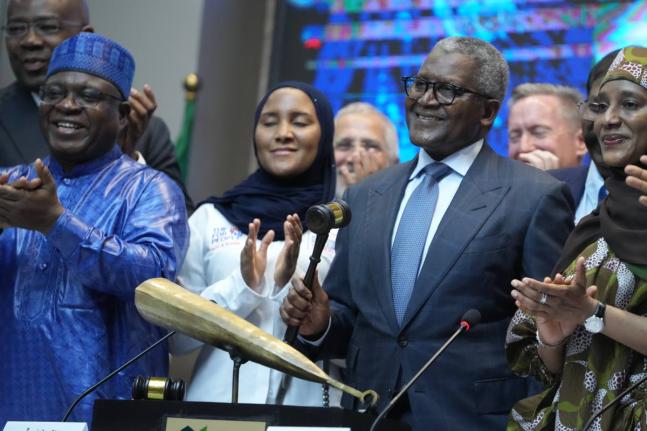 Nigerian industrialist Aliko Dangote (foreground, second right) flanked by executives and stakeholders at the Nigeria Stock Exchange. 