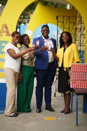  Members of the Naggo Head Infant School community display boxes of Nutri+ Milk during the handover on Friday, September 4. Pictured are Joylyn Fuller-Hunter;  Shanika Clarke-Cown; Rodain Richardson, chairman; and Sophia Francis, Principal. Nutri+ Milk has