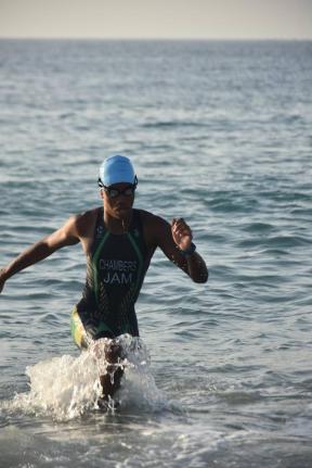 Jamaica Triathlete Kristof Chambers makes a dash to the shoreline during the Carifta Trials on July 19.
